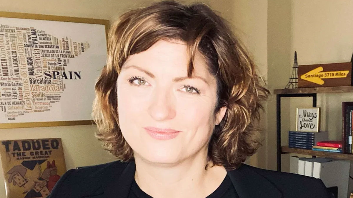 A woman poses for the camera.