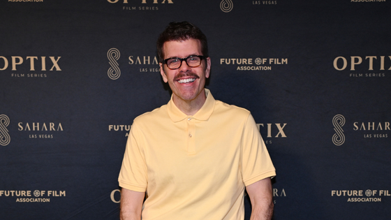 A man poses for a photograph.